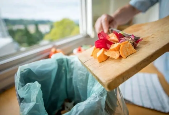 food waste being thrown into the trash bin