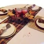 table setting with an embroidered tablecloth